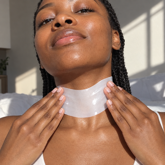 Hands pressing a hydrogel patch smoothly onto the neck